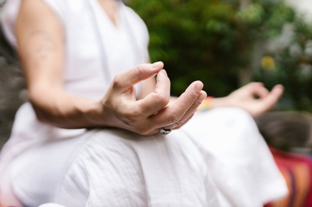 Aged woman practicing meditation for deep spiritual connection