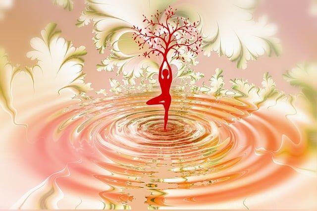 spiritual woman in yoga position with tree of life